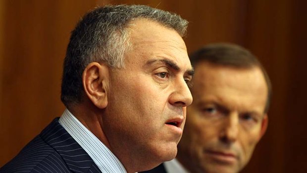Treasurer Joe Hockey with Prime Minister Tony Abbott: The urgency of a budget deficit may be exaggerated, according to leading economists.