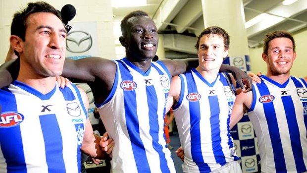 Majak man: Majak Daw celebrates the victory over the Western Bulldogs with his North Melbourne teammates.