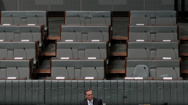 Prime Minister Tony Abbott cuts a lonely figure in Parliament on Monday.