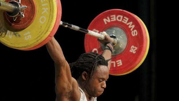 Weight of the world &#8230; Cameroon-born Daniel Koum competes in the final Olympic trial in Brisbane yesterday.