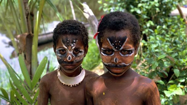 Tribal culture ... children in Sepik River, Papua New Guinea.