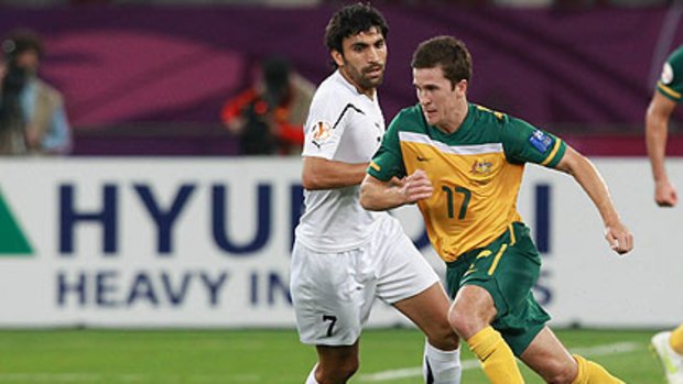 Soceroo Matt McKay runs with the ball during the AFC Asian Cup Semi Final match against Uzbekistan.