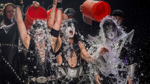 Members of the band KISS get doused for the ALS Ice Bucket Challenge.