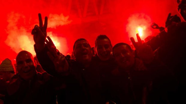 Algerian supporters celebrate their team's World Cup qualification.