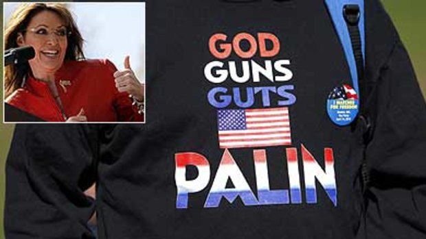 A supporter wearing a sweatshirt attends a Tea Party Express rally in Boston where Sarah Palin, inset, spoke.