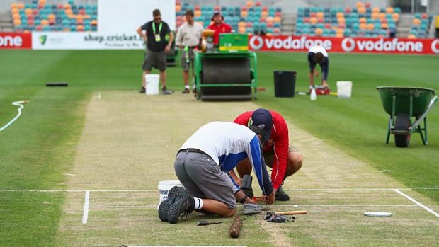 The contentious pitch is prepared at Blundstone Arena, Thursday.
