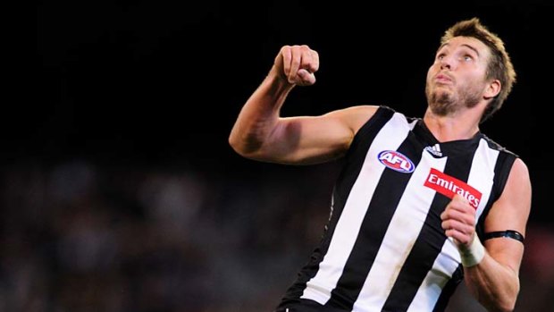 Climbing high: Collingwood's Dale Thomas uses Taylor Hunt as a step-ladder on Friday night.