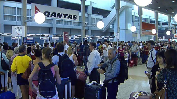 Long queues at Brisbane Airport after Qantas check-in system fails.