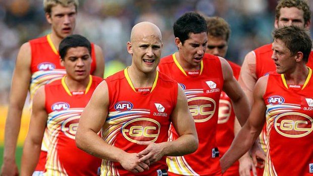 Suns captain Gary Ablett leads his players off the field at half-time during the round 11 match against West Coast Eagles.
