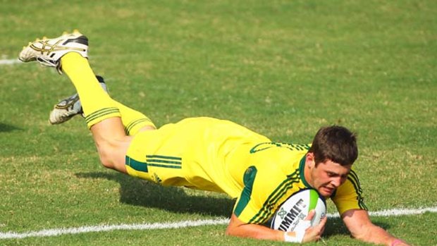 Red hot . . .  Liam Gill scores for Australia during the Commonwealth Games.