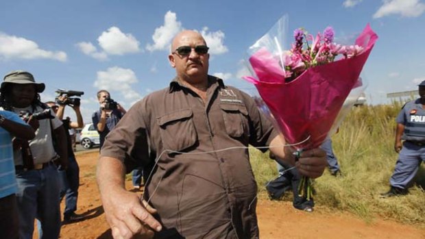 Friends and followers pay their respects at the gate to Eugene Terre'Blanche's farm.