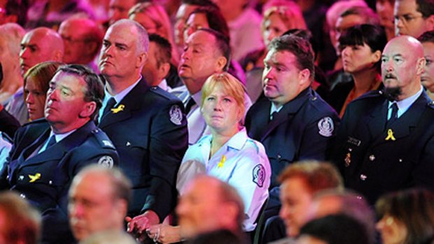 Lauded ... Country Fire Authority members in dress uniform at the Rod Laver Arena yesterday. For many it was too soon, the tragedy of the fires still too raw to attend such a commemoration.