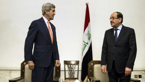 US Secretary of State John Kerry meets Iraqi Prime Minister Nouri al-Maliki, right, at the Prime Minister's office in Baghdad on Monday.