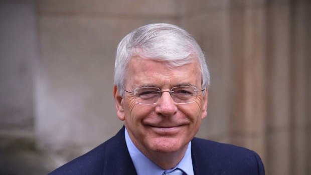 Former British prime minister John Major arrives to give evidence at the Leveson Inquiry into media ethics at the High Court in London.