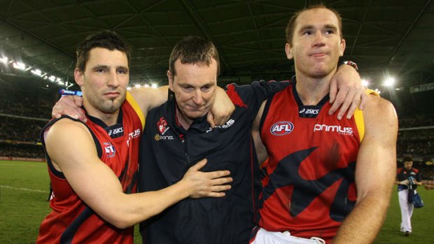 Russell Robertson and  David Nietz with Neale Daniher after his last game as Melbourne coach in 2007. Daniher has been diagnosed with a serious medical problem.