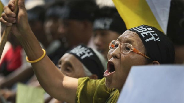 A Tibetan exile woman shouts slogans against the Chinese government during a rally to mark Tibet Solidarity Day in New Delhi.