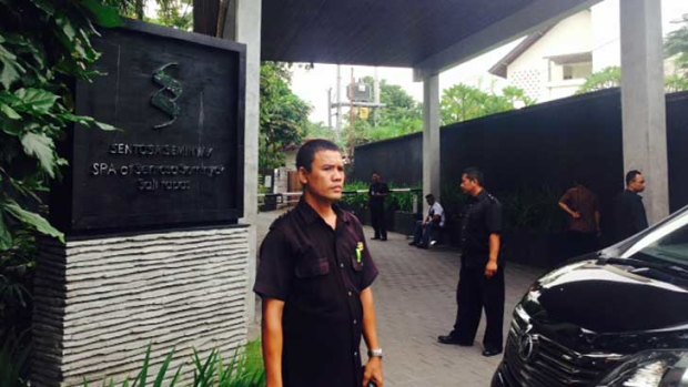 Security guards stand outside the spa complex that Schapelle Corby was driven into.