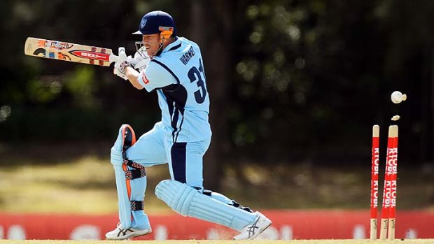 David Warner is bowled by Scott Boland of the Bushrangers at Bankstown Oval on Monday.