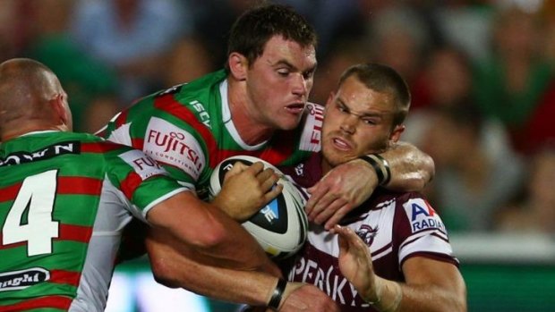 Souths player and former Raider Joe Picker makes a tackle against Manly.
