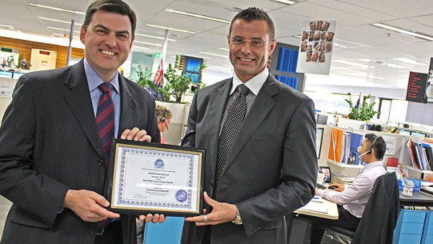 Western Power acting chief executive officer Paul Italiano and customer call centre manager Ben Oxford.