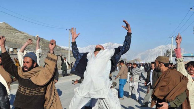 Burning with anger across Afghanistan ... protesters shout anti-US slogans.