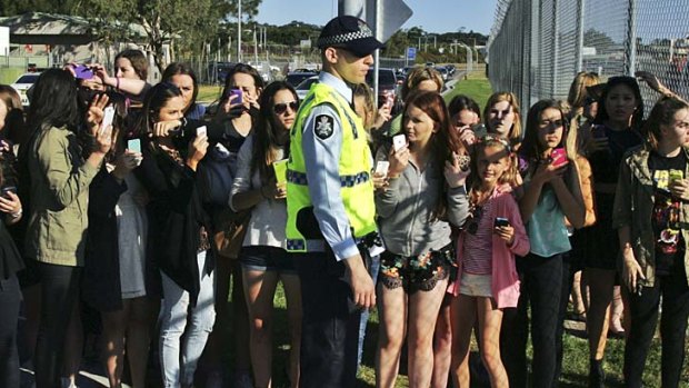 You've got that mob thing: Fans of One Direction flocked to Sydney Airport on Friday for a chance to see the group.