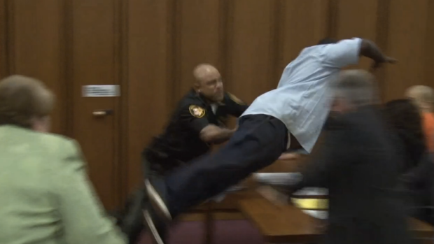 Courtroom footage shows Van Terry diving towards his daughter's killer, Michael Madison.
