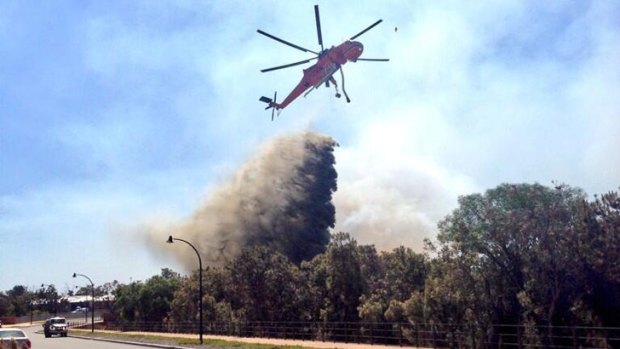 Aerial crews water-bombing a bushfire.