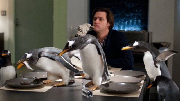 You think that's funny?: Jim Carrey (centre) jokes it up opposite a cast of CG-penguins in the low-flying kiddie comedy Mr Popper's Penguins.