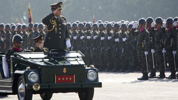 General Prayuth Chan-ocha, Commander in Chief of the Royal Thai Army, reviews the troops at their barracks on Thailand's Armed Forces Day earlier this month.