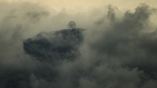 The Large Millimeter Telescope, surrounded by clouds, on the peak of the Sierra Negra volcano at Pico De Orizaba National Park near Ciudad Serdan, Mexico.