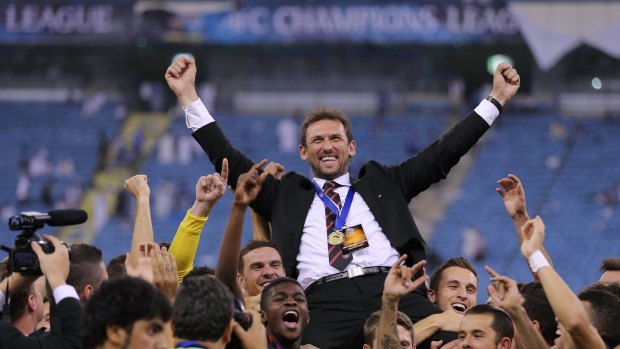 Wanderers coach Tony Popovic enjoys the moment his side won the Asian Champions League. 