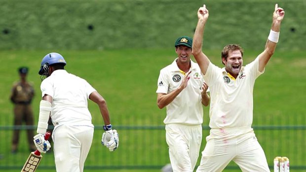 Another one gone: Ryan Harris celebrates the wicket of Sri Lanka's Thilan Samaraweera.