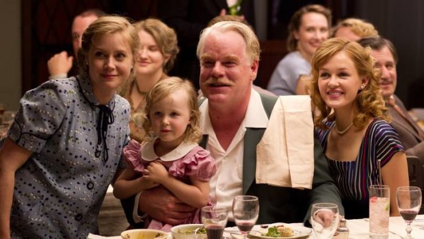 Amy Adams, left, and Philip Seymour Hoffman, center, in a scene from The Master.