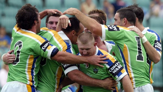 Canberra players celebrate Jason Croker's try against the Eels on April 13, 2003.