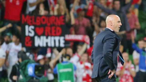 Heart fans celebrate as Victory coach Kevin Muscat leaves the field.