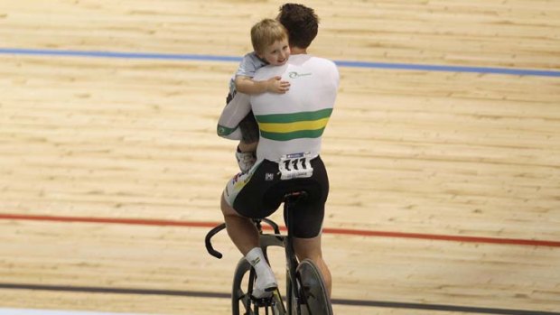 Wish come true &#8230; Shane Perkins takes his three-year-old son Aidan on his victory lap after winning the team sprint world title in Melbourne.