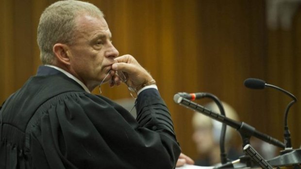 State prosecutor Gerrie Nel questions Oscar Pistorius in court on Friday.