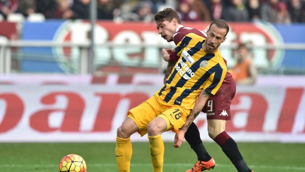 Victory target: Vangelis Moras, front, in Serie A action for Hellas Verona.