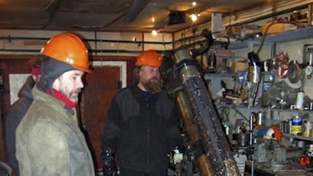 Researchers work with drilling apparatus at the Vostok camp in Antarctica.