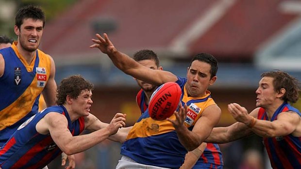 No, you don't: Williamstown's Brett Goodes tries to get through a heavy track.