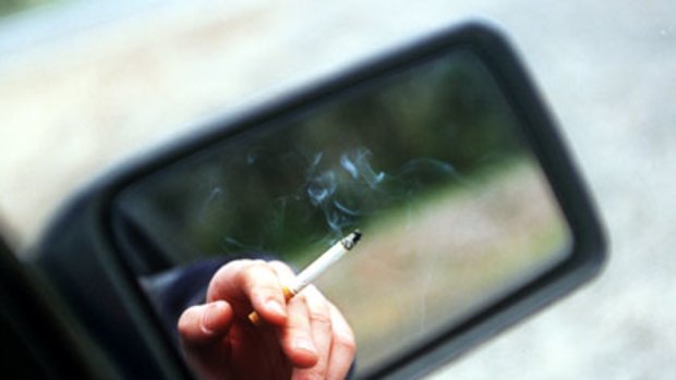 Smoking in cars with other passengers may be banned in Queensland.