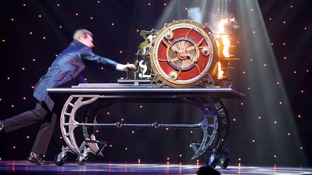 Magician Mark Kalin performs in <i>The Illusionists</i>.