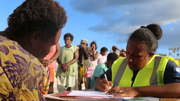Red Cross volunteers in Vanuatu assess people’s needs after cyclone Pam in March. 