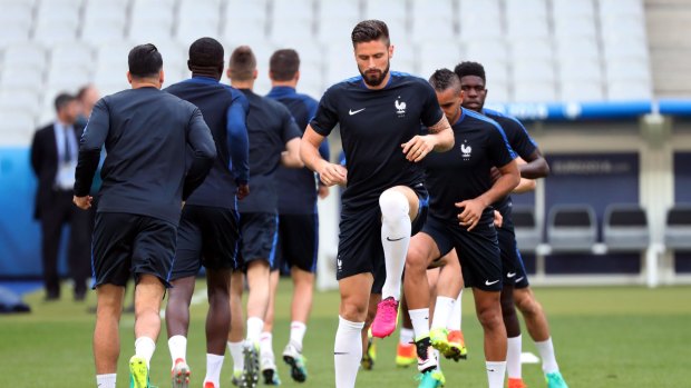 Grand designs: Olivier Giroud stretches during a France training session.