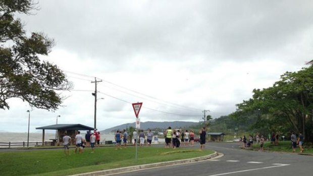 Crowds gather to watch the high tide at Airlie Beach on Friday morning. Photo: Chris Campey/Ten News, via Twitter.