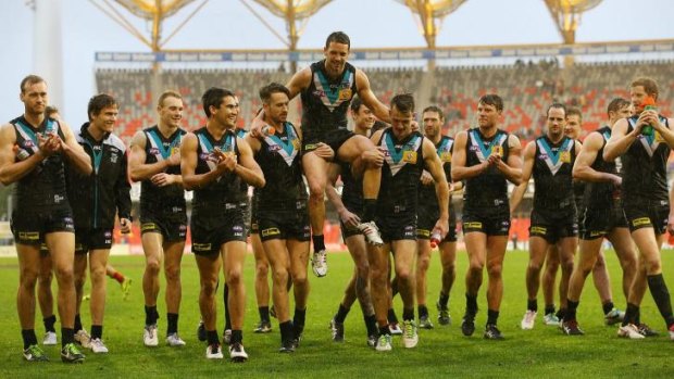 Port Adelaide captain Travis Boak is chaired from the ground on Saturday after what was his 150th game.