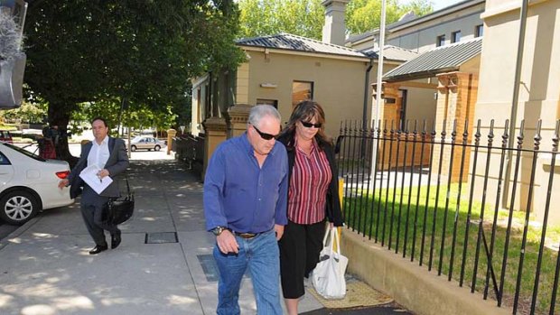 IN COURT: Alleged one-punch attacker Karl Sibley's mother and step-father leave Orange Local Court after the accused's hearing on Monday morning.