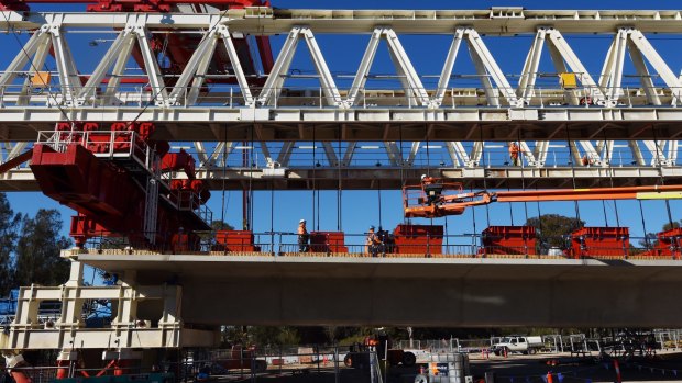 A Skytrain span being assembled by one of two massive moveable gantries in 2015.