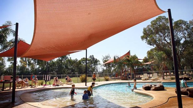 River idyll... children cool off in the pool.